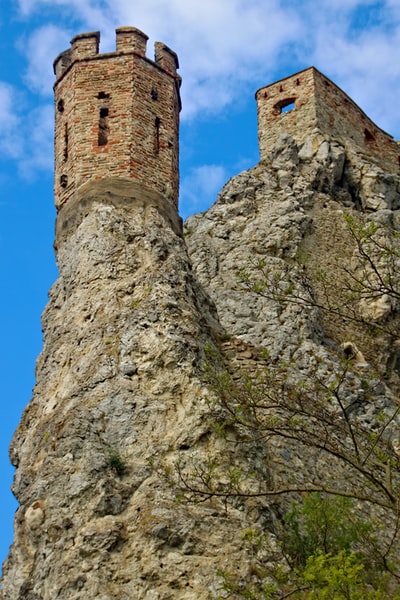 Gray rock strata under the blue sky during the day
